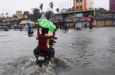 Indian residents ride on a bike along a flooded road after Cyclone Fani landfall in Puri, in the eastern Indian state of Odisha, on May 3rd, 2019.