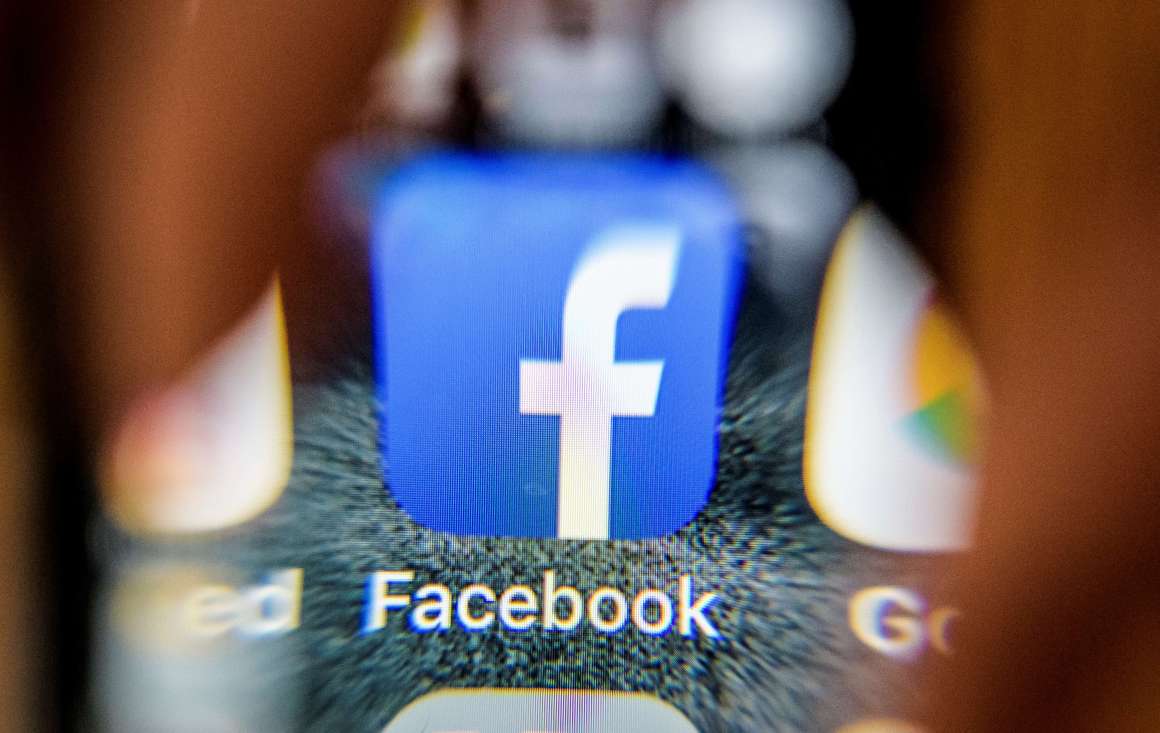 The Facebook icon on a smartphone screen.